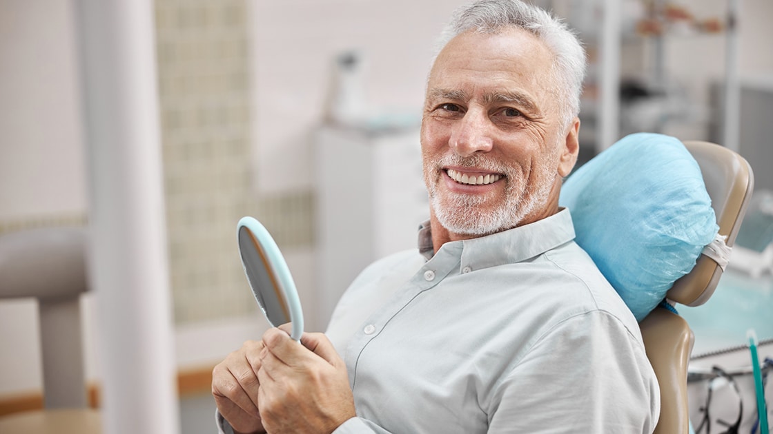 Man Smiling In Mirror